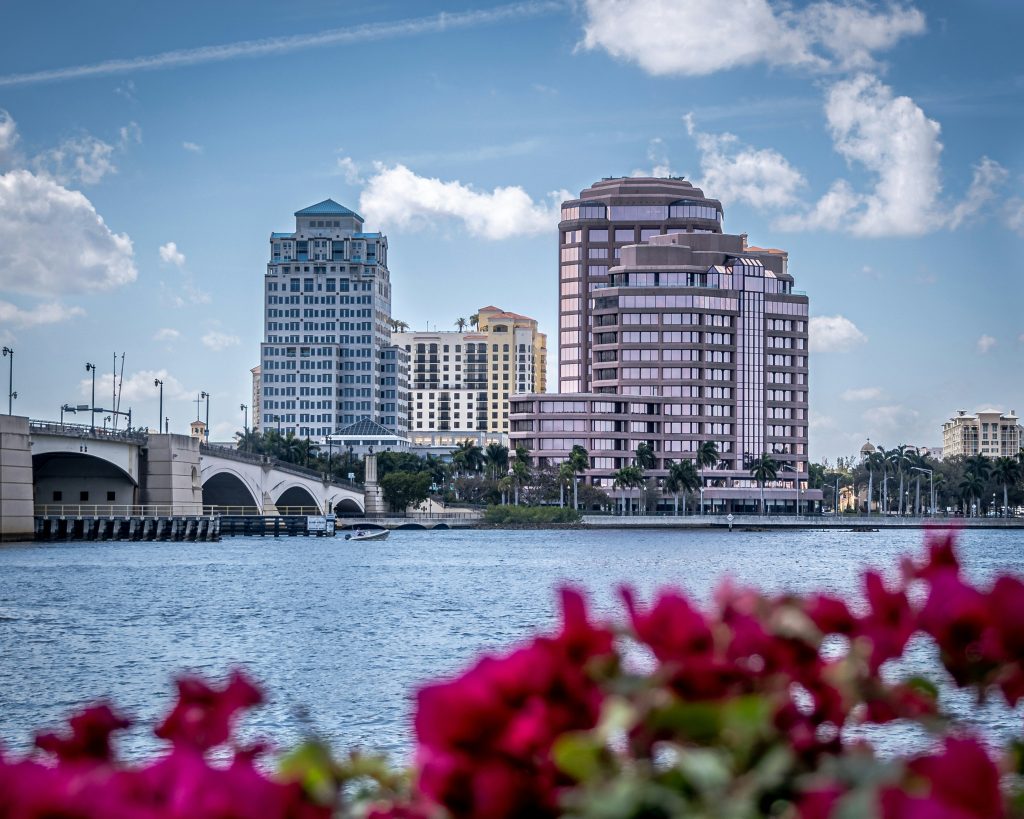 The West Palm Beach skyline across the Intracoastal Waterway, with bougainvillea in the foreground